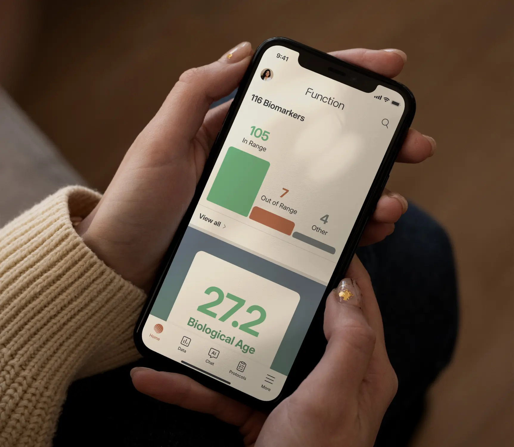 Person holding the Function app showing biomarker insights